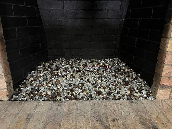 glass lava rocks in fireplace